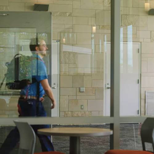 Student walking near double door airlock